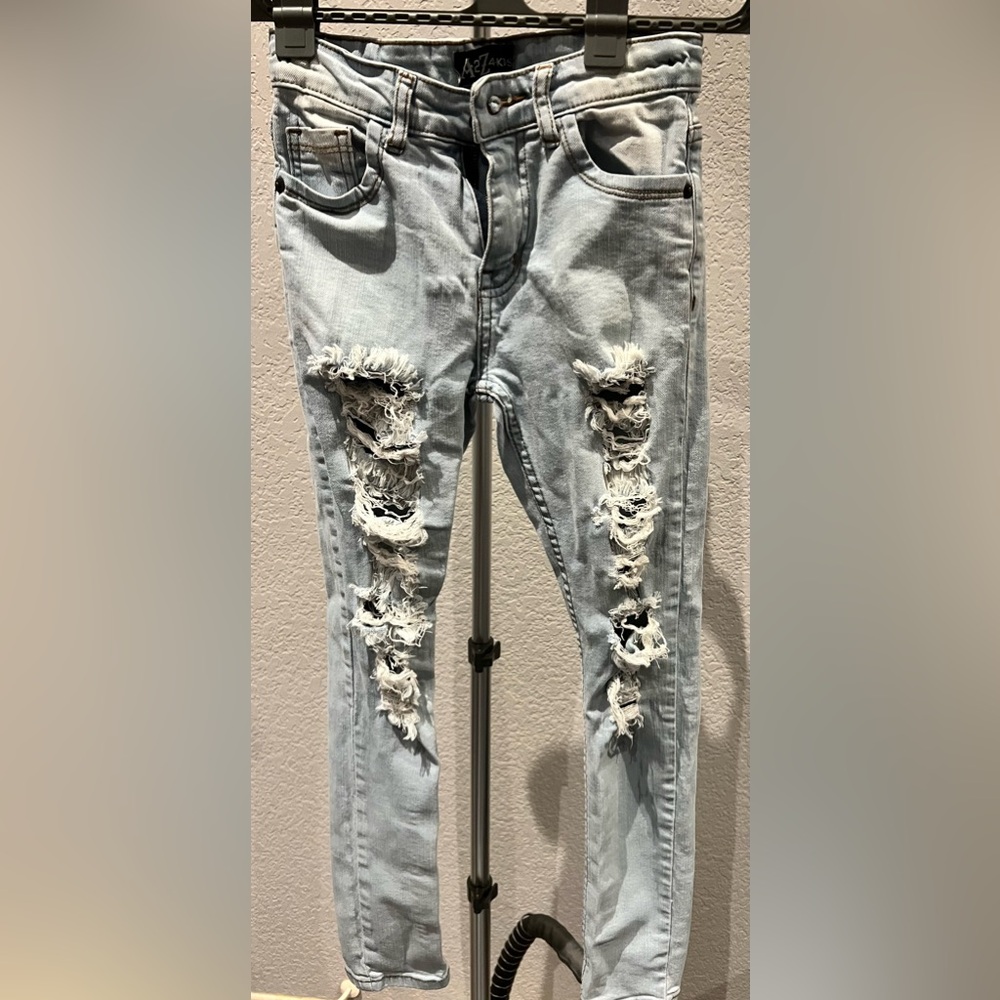 Girls Ripped skinny jeans, size unknown but my grand daughter was 10.